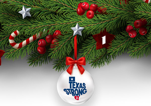 image of a texas strong ornament hanging from garland